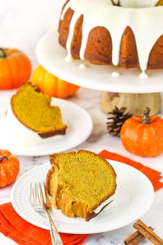 a slice of pumpkin bundt cake with white icing on plates next to the bundt cake