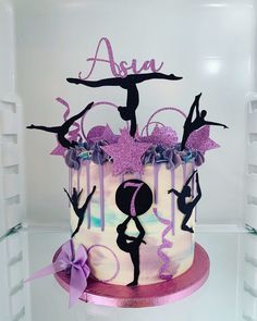 a cake decorated with purple and black icing