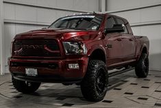 a large red truck parked in a garage