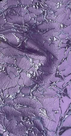 an image of the surface of some kind of purple and white substance that looks like it is