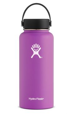 the hydro flask water bottle is red and has a black lid, with an imprint on