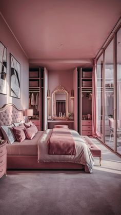 a bedroom with pink walls and carpeted flooring has a large bed, two dressers, and a mirror on the wall