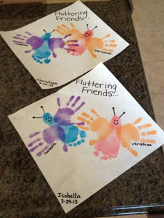 two children's handprints with the words fluttering friends on them