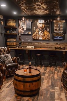 a man cave with two leather chairs and a wooden barrel