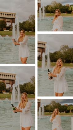 a woman is holding a bottle in front of a fountain