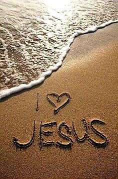 i love jesus written in the sand at the beach