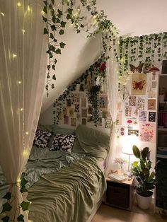 an unmade bed with ivy growing on the walls and curtains over it, in a bedroom