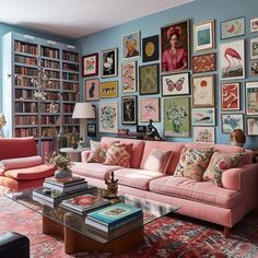 a living room filled with lots of furniture and pictures on the wall above it's coffee table