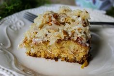 a white plate topped with a piece of cake