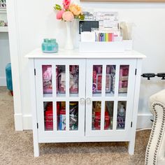 a white cabinet filled with lots of different items