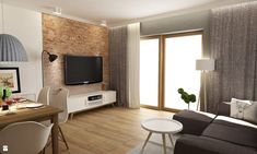 a living room filled with furniture and a flat screen tv on top of a wooden table