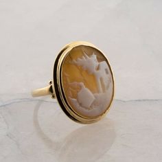 Vintage 10K Yellow Gold Shell Cameo Ring, scenic cameo, Ring size 6, 4.12 gramsStock # BB302R01Most rings are sizable for a small fee. If the ring you are considering is the incorrect size contact us for a quote.This listing contains photographs of the actual item you will receive. Our items are in excellent condition with little or no signs of wear and many are one of a kind pre-owned estate finds. Please look closely at the pictures in this listing as they are part of the product description. Gold Oval Cameo Rings, Cameo 14k Gold Rings For Collectors, Collectible 14k Gold Cameo Rings, 14k Gold Cameo Rings For Collectors, Heirloom Oval Rings For Memorial, Heirloom Oval Ring For Memorial, Yellow Gold Cameo Signet Ring, Classic Oval Cameo Rings, Oval Cameo Yellow Gold Ring