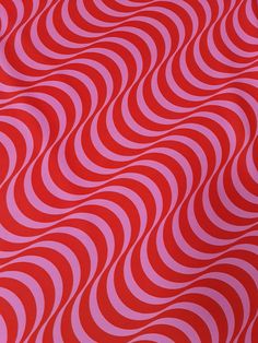 an abstract red and pink background with wavy lines