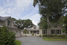 a large house with lots of trees in front of it