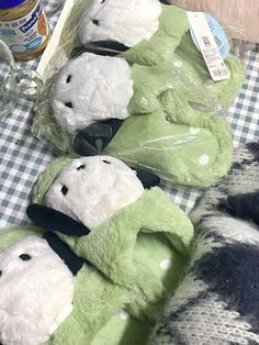 four stuffed animals sitting on top of a table