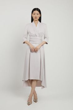 Feel Formal In Our Maxi Dress, Which Boasts A High Low Hemline, A Wrap Waist Panel For A Cinched Fit And Flare Silhouette, And Three Quarter Length Sleeves, Ideal For Interseasonal Dressing. Styles Well With Strappy Heels For A Statement Occasion Look, Perfect For Ladies Day, Wedding Guest Days, And Formal Occasions. Satin Back Crepe Wrap Tie High Low Midaxi Dress High Quality Satin Backed Crepe Fabric V Neckline Statement Structured Shoulders Three Quarter Length Sleeves Wrap Accent For A Cinch Elegant Wrap Maxi Dress For Daywear, Pre-draped V-neck Dress For Work, Semi-formal Silk V-neck Dress, Elegant Wrap Midi Dress For Daywear, Elegant Formal Wrap Midi Dress, Elegant Wrap Dresses For Formal Occasions, Silk Wrap Dress For Spring Formal, Spring Formal Silk Wrap Dress, Elegant Silk Wrap Midi Dress