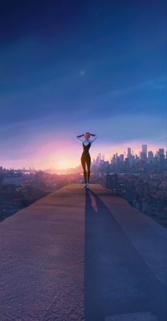 a woman standing on top of a tall building with her arms behind her head as the sun sets