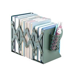 a stack of folders and binders in a holder