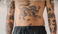 a man with tattoos on his stomach and chest