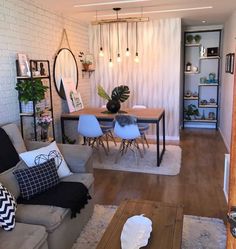 a living room filled with furniture and a wooden table