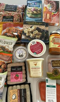 an assortment of meats and cheeses are laid out on the counter top for consumption