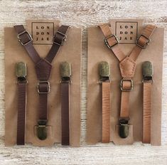 three leather suspenders with brown and tan straps on top of a piece of paper