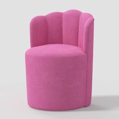 a pink chair sitting on top of a white floor