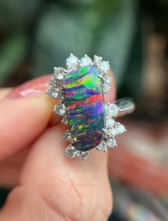 Item Information Weight (ring)           8.56g Weight (opal)           3.40cts Size (opal)                15.1×7.3×3.5mm Weight (diamonds )      0.595cts The size of the ring can be risized Attention：This is a collectible level Opal jewelry, It's second-hand jewelry auctioned from Japan There are no quality issues or cracks, Accompanied by the certificate* More Affordable price，Only make a reasonable profit，So I can offer a high quality item and affordable price for every customers， Better servi Luxury Opal Rings With Gemstones, Formal Multicolor Opal Gemstone Ring, Luxury Opal Rings With Gemstone Accents, Exquisite Diamond Opal Ring, Exquisite Opal And Diamond Ring, Exquisite Opal Diamond Ring, Luxury Ethiopian Opal Ring As A Gift, Luxury Ethiopian Opal Ring For Gift, Elegant Multicolor Cabochon Opal Ring