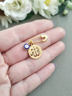 "Allah Evil Eye Brooch Pin, Mini Small Gold Safety Pin with Blue Evil Eye Nazar Allah Name charm Tiny mini pin for Allah protection. 1\" / 2.5cm long This makes a beautiful and unique gift for a little baby which will be treasured forever. A perfect gift for either a new mum on the birth of her baby, or a gift for Mother's Day or a baby shower. You can decorate a baby pram, a nappy bag or a nursery room with it." Personalized Safety Pin Gift, Blue Brooch Pins As A Gift, Blue Brooch Pins For Gift, Blue Round Brooch For Gift, Blue Brooch Pin As Gift, Blue Brooch Pin For Gift, Handmade Blue Pins For Gifts, Blue Brooch Lapel Pin As Gift, Blue Round Brooches For Gifts