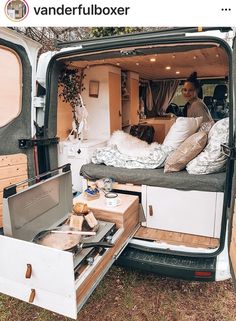 a man sitting in the back of a van with food