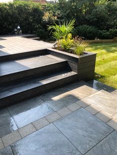 an outdoor patio with steps leading up to it