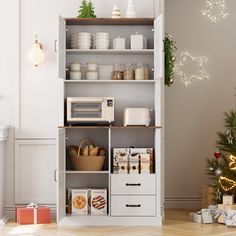 an open bookcase next to a christmas tree