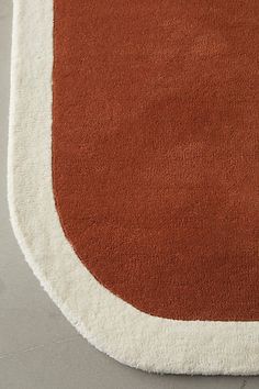 a brown and white rug on the floor