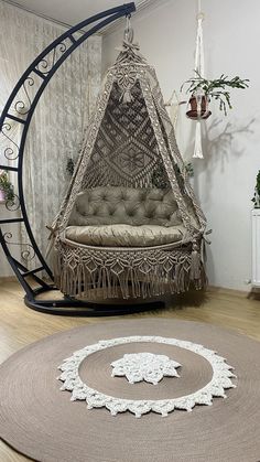 a hammock chair and rug in a room