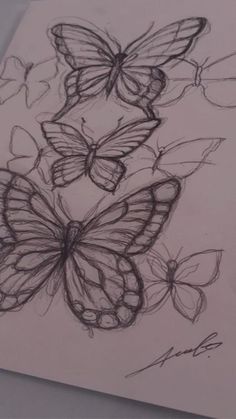 a drawing of three butterflies on a piece of paper