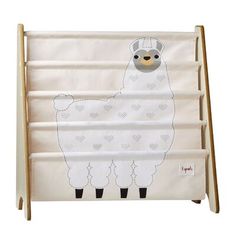 a white and brown llama toy rack with hearts on it's sides, in front of a white background