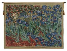 a tapestry with blue irises and other flowers on the front, hanging from a wall