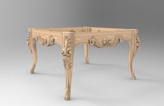 an antique wooden table with carvings on it