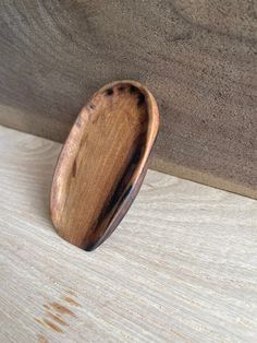 a wooden object sitting on top of a table