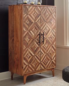 Diamond life. Make a bold, brilliant statement with this accent cabinet. A decidedly contemporary choice, this double-door cabinet with two interior shelves wows with its diamond inlay patterned design and masterful mix of light and medium brown finishes. Mid-century style pulls add a retro-chic touch. More About This Product Weight & Dimensions Dimensions Full Dimension 36W x 18D x 60H Weight Weight 196lbs. Pintu Ganda, Craft Supply Storage, Interior Shelves, Wide Sideboard, Diamond Life, Ashley Furniture Homestore, Accent Doors, Black Doors, Accent Cabinet