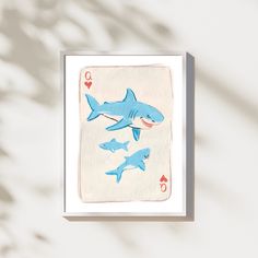 a card with sharks on it and playing cards in the shape of hearts are shown