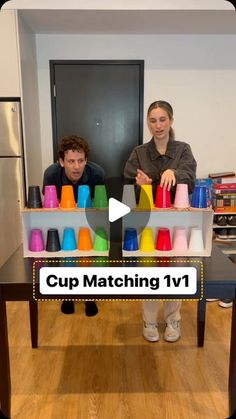 two people sitting at a table with cups in front of them and the caption cup matching iv1