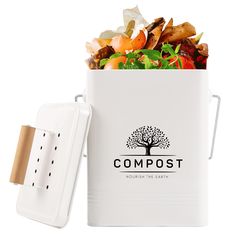 a white compost container filled with lots of food