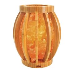 a wooden container filled with oranges on top of a white background