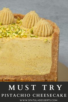 a piece of pie with pistachio cheesecake toppings on top and the words must try