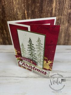 two christmas cards with pine trees on them