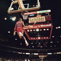 a basketball player dunking the ball into the air