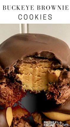 a close up of a chocolate covered cookie with the words, buckeye brownie cookies