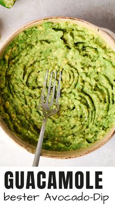 guacamole in a bowl with a fork on top and the text overlay reads, guacamole best avocado dip