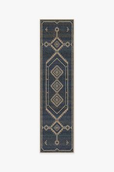 a blue and beige rug with an intricate design on the bottom, in front of a white background